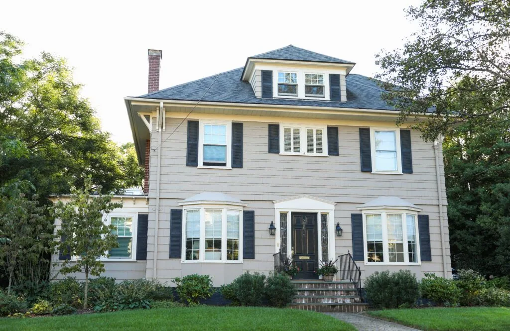 Suburban house exterior under a sunny blue sky