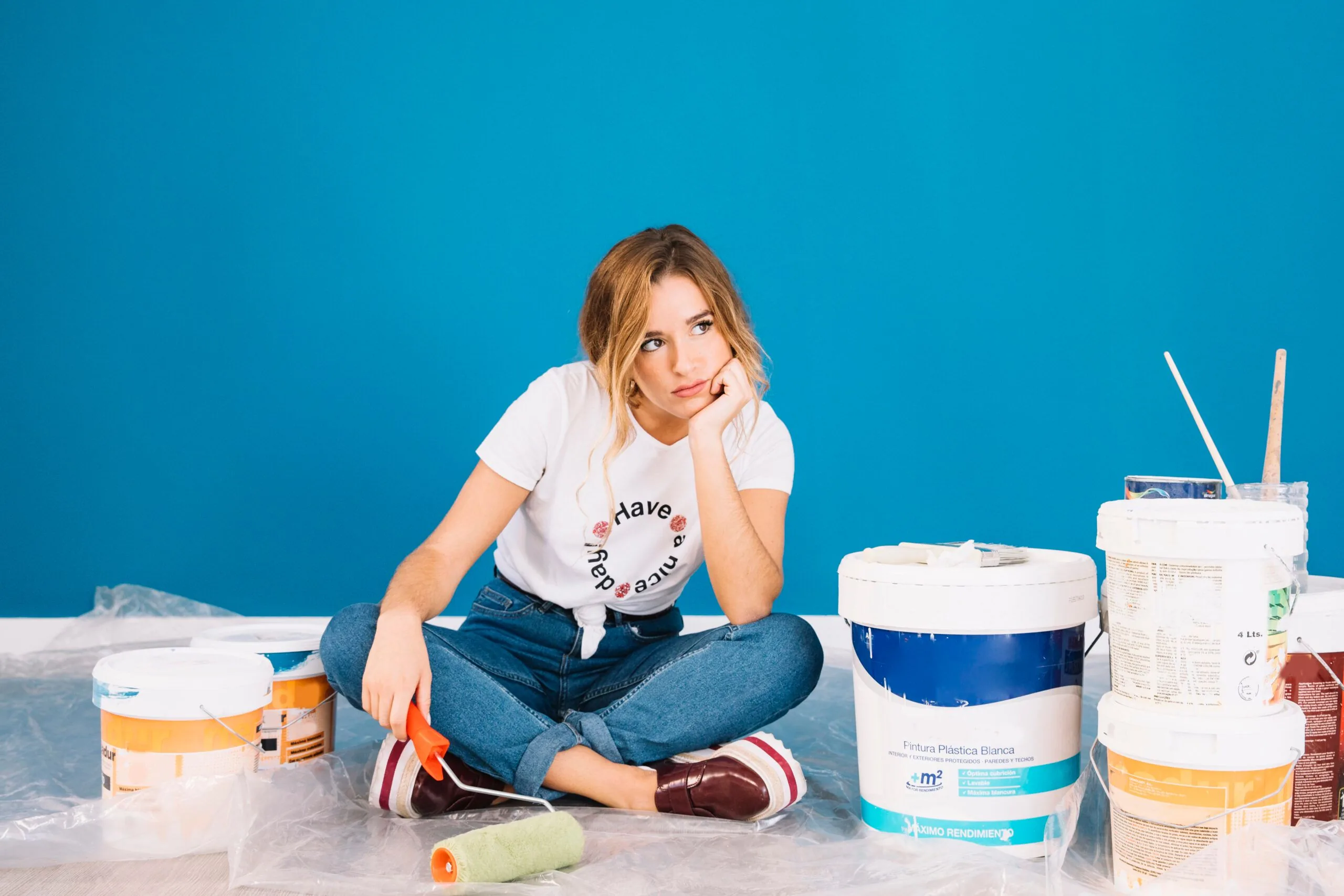 Girl sitting paint materials