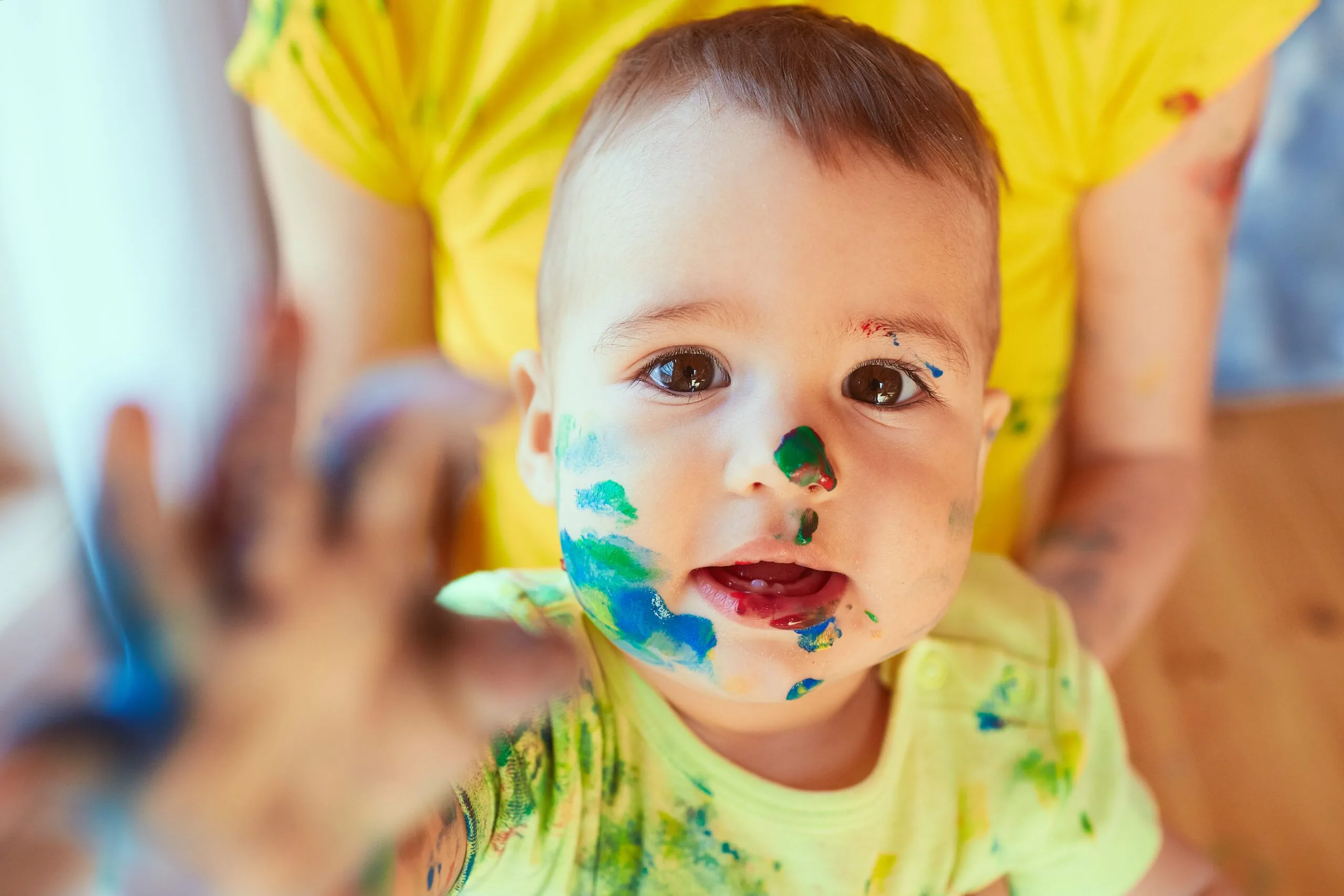 Small baby has paint his face
